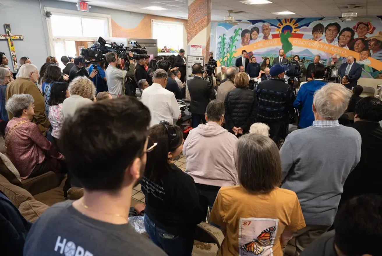 A crowd gathers a press conference at Annunciation House in El Paso on Feb. 23, 2024. Texas Attorney General Ken Paxton sued the migrant shelter, accusing it of operating a stash house and human trafficking. A judge on Tuesday ruled in favor of Annunciation House, which has been providing aid and shelter to migrants in El Paso for decades.